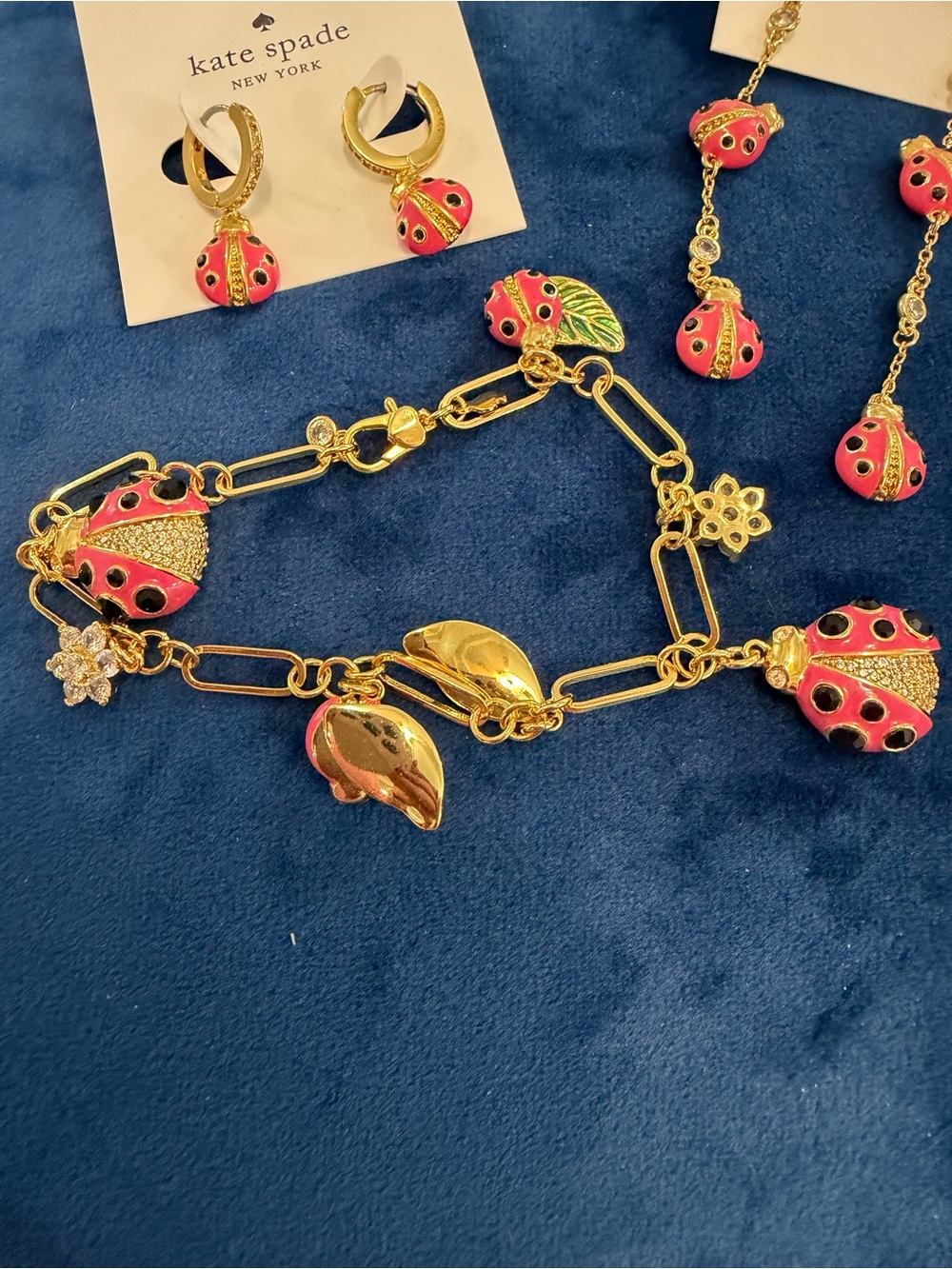 kate spade Gold-tone Pink Ladybug Charm Earrings and Bracelet.  Two earrings.